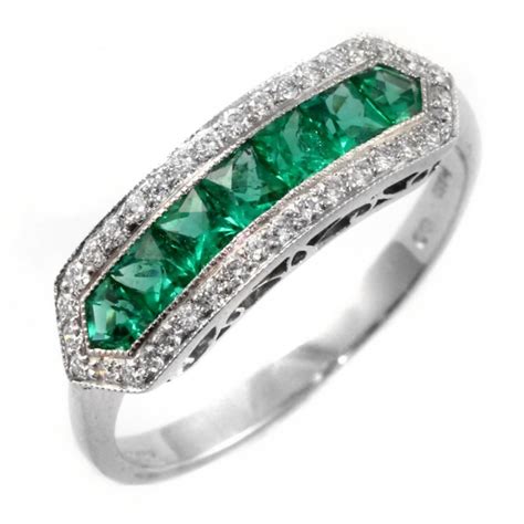 Art deco colombian emerald flanked solitaire ring. Platinum emerald & diamond eternity art deco style ring ...