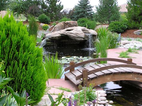 Beautiful Pond With A Spouting Rock Waterfall Backyard Water Feature