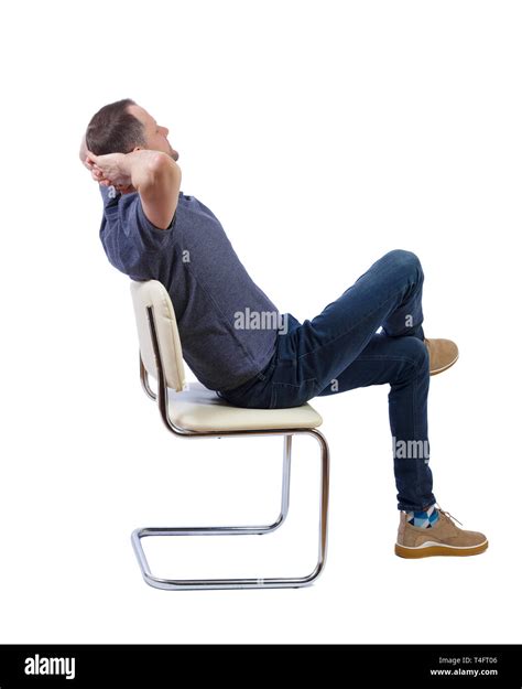 Side View Of A Man Sitting On A Chair Rear View People Collection
