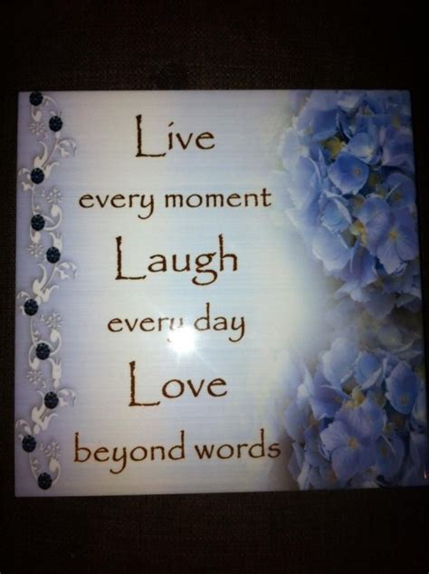 A Sign With Flowers On It That Says Live Every Moment Laugh Every Day