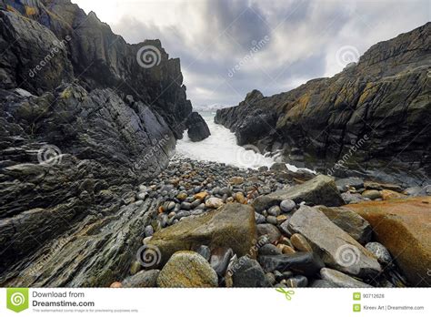 Ancient Stones On The Shores Of Cold Norwegian Sea At Evening Time