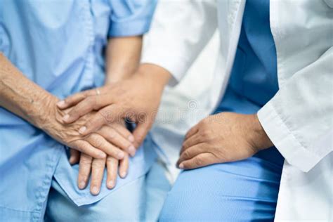 Doctor Touching Hands Asian Senior Or Elderly Old Lady Woman Patient