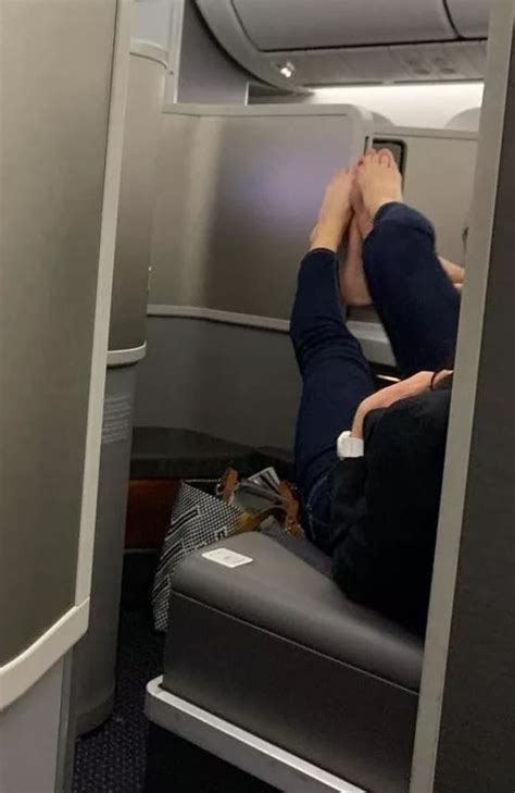 First Class Passengers Play ‘footsie’ Across Seat Dividers On Flight