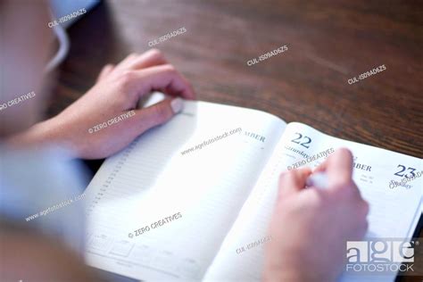 Close Up Of Female Writing In Diary Stock Photo Picture And Royalty Free Image Pic CUL