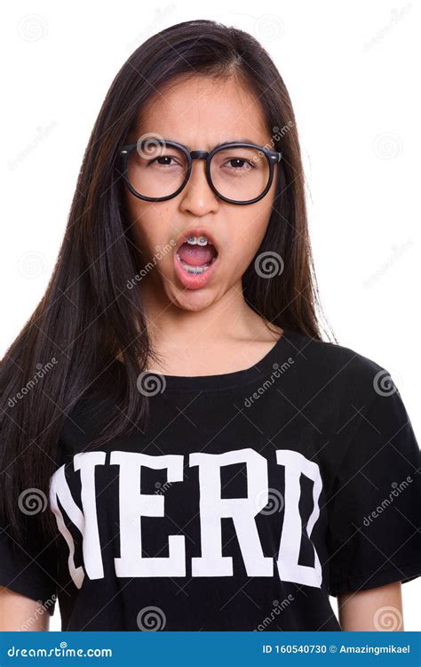Close Up Of Young Asian Teenage Nerd Girl Looking Angry Stock Photo