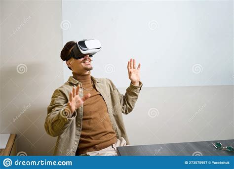 Joyous Corporate Worker Undergoing Virtual Reality Training In