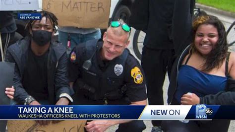 Officers Take A Knee With Protesters