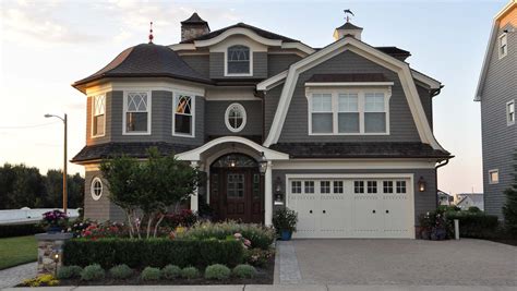 Browse 230 photos of exterior garage and shed paint colors. Beautiful custom dark gray beach home. Gambrel roofing ...