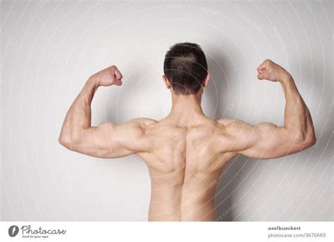 Asian Fitness Model Flexing Muscles A Royalty Free Stock Photo From