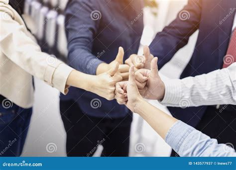 Group Of Business People Giving Thumbs Up Gesture Of Approval An