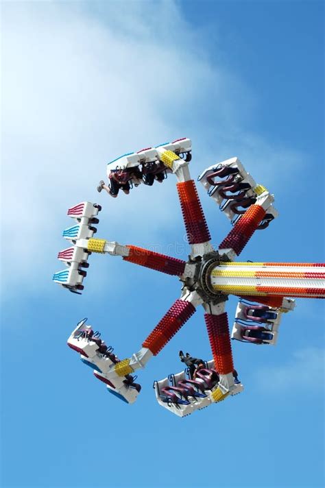 teens go upside down on carnival ride editorial stock image image of