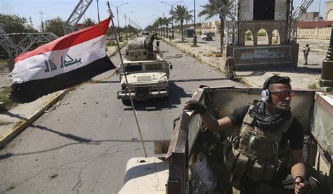 Iraqi Teams Start Exhuming Mass Grave Of Soldiers In Tikrit