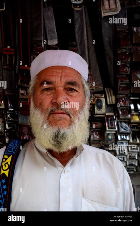 Portrait Of Pashtun Pakistani Man Posing Outside Belt Shop Empress