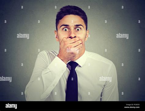 Shocked Scared Man Covering His Mouth With His Hand Stock Photo Alamy