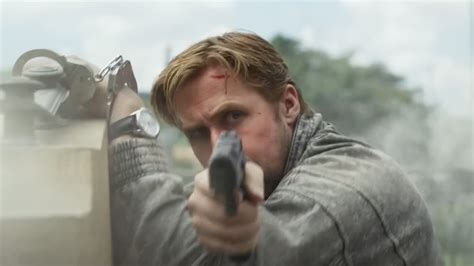 The Gray Man Trailer Its Ryan Gosling Vs Chris Evans In The Russos Spy Thriller