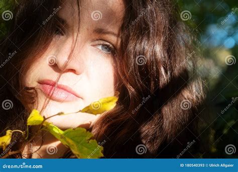 Portrait Of A Beautiful Dark Haired Young Seductive Enigmatic Woman In