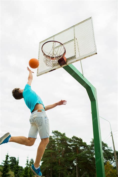 Premium Photo Sport Game And Basketball Concept Young Man Throwing