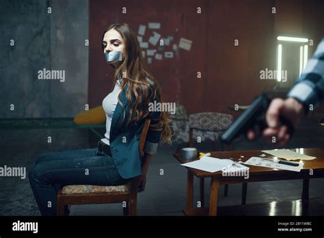Maniac Kidnapper With A Gun Scared Female Victim Stock Photo Alamy