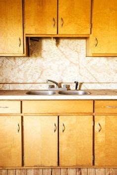The kitchen cabinets and woodwork in our home are dark stained. Restoring Mid-Century Wood Cabinets — To clean and restore ...