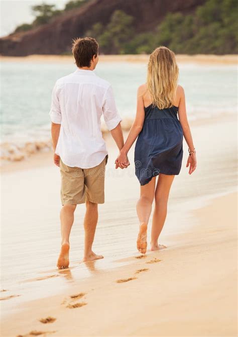 Romantic Happy Couple Walking On Beach At Sunset Stock Photo Image Of
