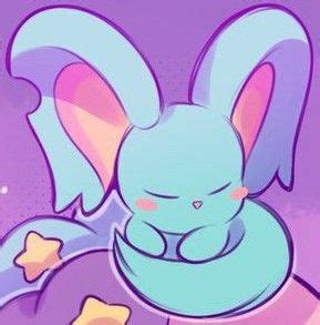 A Blue Bunny With Stars Around Its Neck Sitting On Top Of A Star Shaped