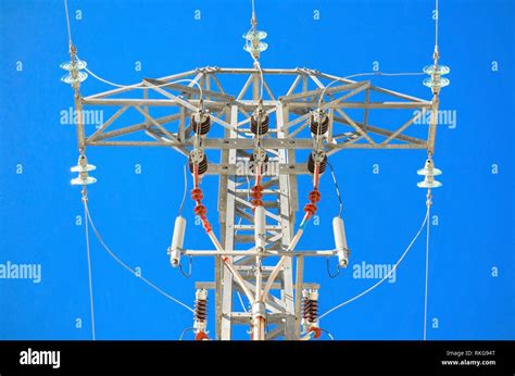 High Voltage Power Line Over Brightly Blue Sky Stock Photo Alamy