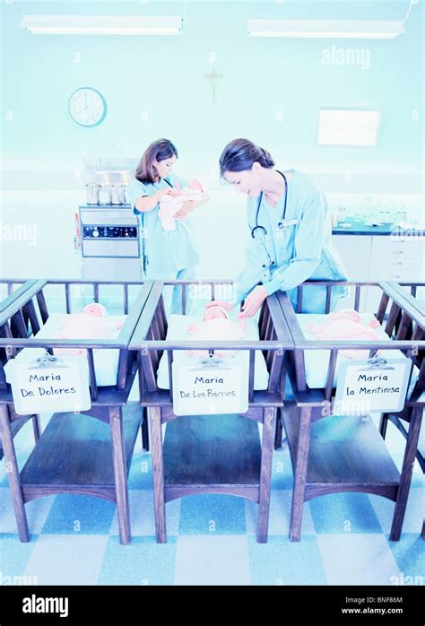 Nurses Taking Care Of Babies At The Hospital Maternity Ward Stock Photo