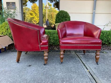 Featuring an alluring chrome nail head trim which makes for a precise appearance. Pair of 20th Century English Red Leather Barrel Chairs For ...
