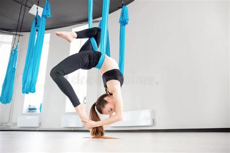 Aerial Fly Yoga In White Gym Young Gymnastics Women In Blue Hammock Stock Image Image Of