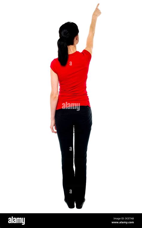 Back Pose Of Woman In Casuals Pointing Away Isolated Against White