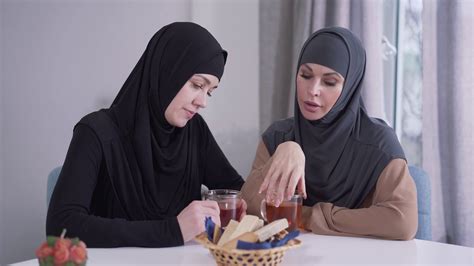 Two Thoughtful Muslim Women Sitting At Table Stock Footage Sbv 338125139 Storyblocks