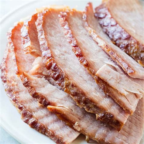 Since spiral hams are already fully cooked, you basically just want to warm it through, infuse it with flavor, and crisp up the edges, all while avoiding place your ham in a deep, heavy pot and tent with foil. Slow Cooker Spiral Ham | Recipe | Spiral ham, Slow cooker ...