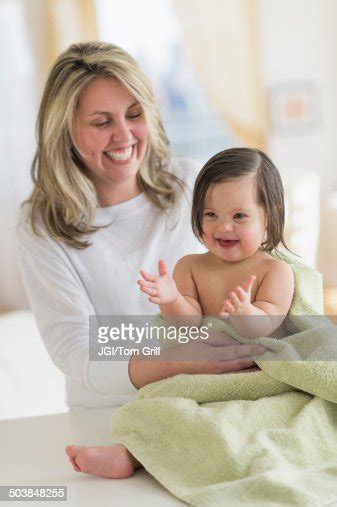 Hispanic Mother Drying Toddler Daughter After Bath High Res Stock Photo