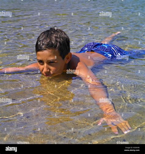 A Boy Lying In Water Stock Photo Alamy