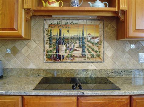 Hand painted art tile showing kitten with butterflies in a victorian border. Tre Sorelle Hand-Painted Tile Mural Installations