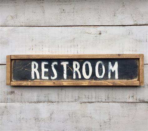It uses a lot of wood and brick, and it has a cozy, homey feeling. Restroom/ bathroom sign/ signs/ sign/ wood sign/ farmhouse ...