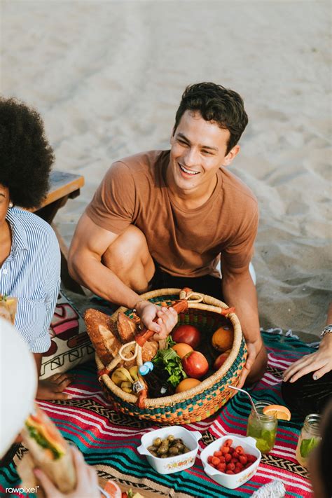 Download premium image of Friends enjoying a beach picnic in the | Beach picnic, Picnic, Picnic ...