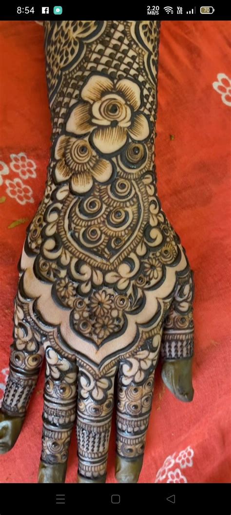 The Hand Is Decorated With Intricate Designs