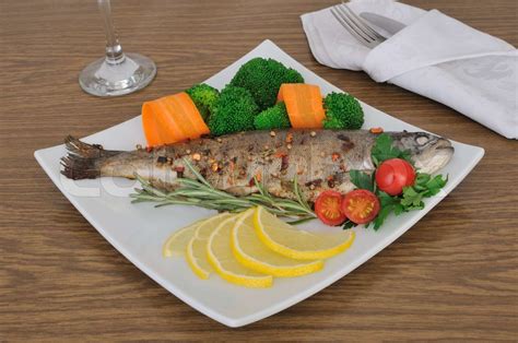 Baked Sea Bass With Broccoli And Carrots Stock Image Colourbox