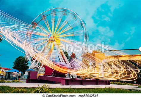 Motion Blurred Of High Speed Rotating Attraction Amusement Park Ferris
