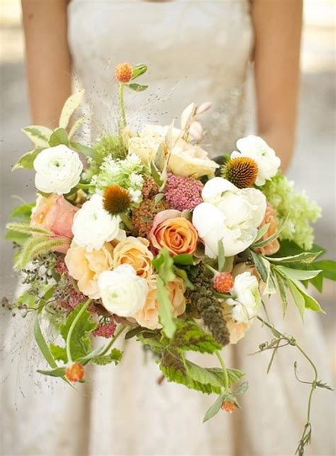 Blurred bride with in a white dress and groom in tuxedo are holding hands. Peach Wedding - Loose And Lovely Bouquet #2063118 - Weddbook