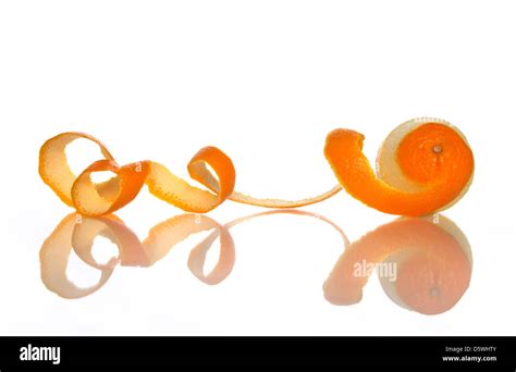 Orange With Peeled Spiral Skin Reflecting On White Background Stock