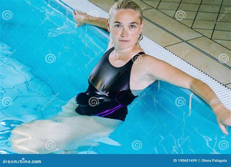 Beautiful Young Woman Relaxing In Indoor Spa Swimming Pool The Girl Is Resting At Hotel Spa