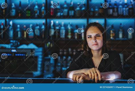 Young Attractive Woman Bartender Behind The Bar Counter Stock Image