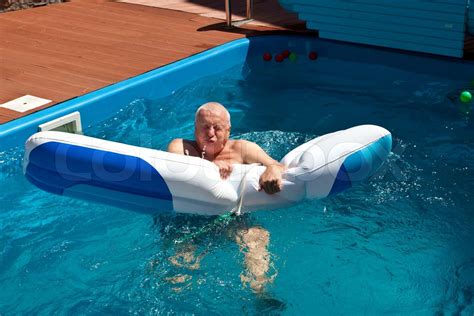 Mature Active Man Getting A Workout At The Swimming Pool Stock Image