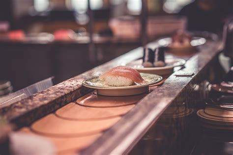 The Woman Puts The Camera On The Sushi Conveyor Belt And The Results