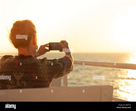 Cruise Ship Vacation Young Woman Enjoying Sunrise On Travel At Sea