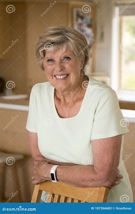 Beautiful Portrait Of Pretty And Sweet Senior Mature Woman In Middle Age Around 70 Years Old