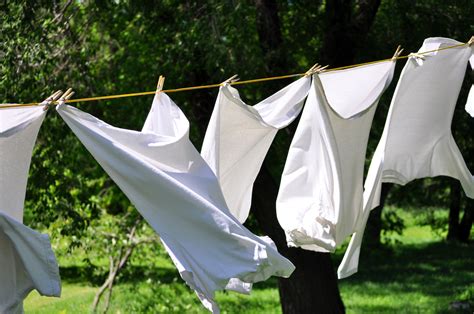 White Clean Laundry Drying On The Clothesline Skyline Enterprises
