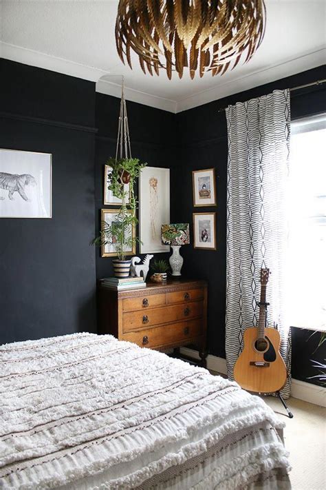 Black Boho Glam Bedroom With Vintage Dresser And Plants